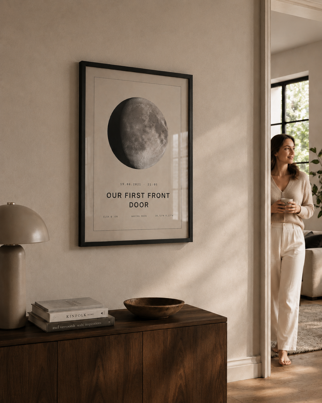 Framed Rule 118 moon print titled Our First Front Door hanging above a dark walnut sideboard